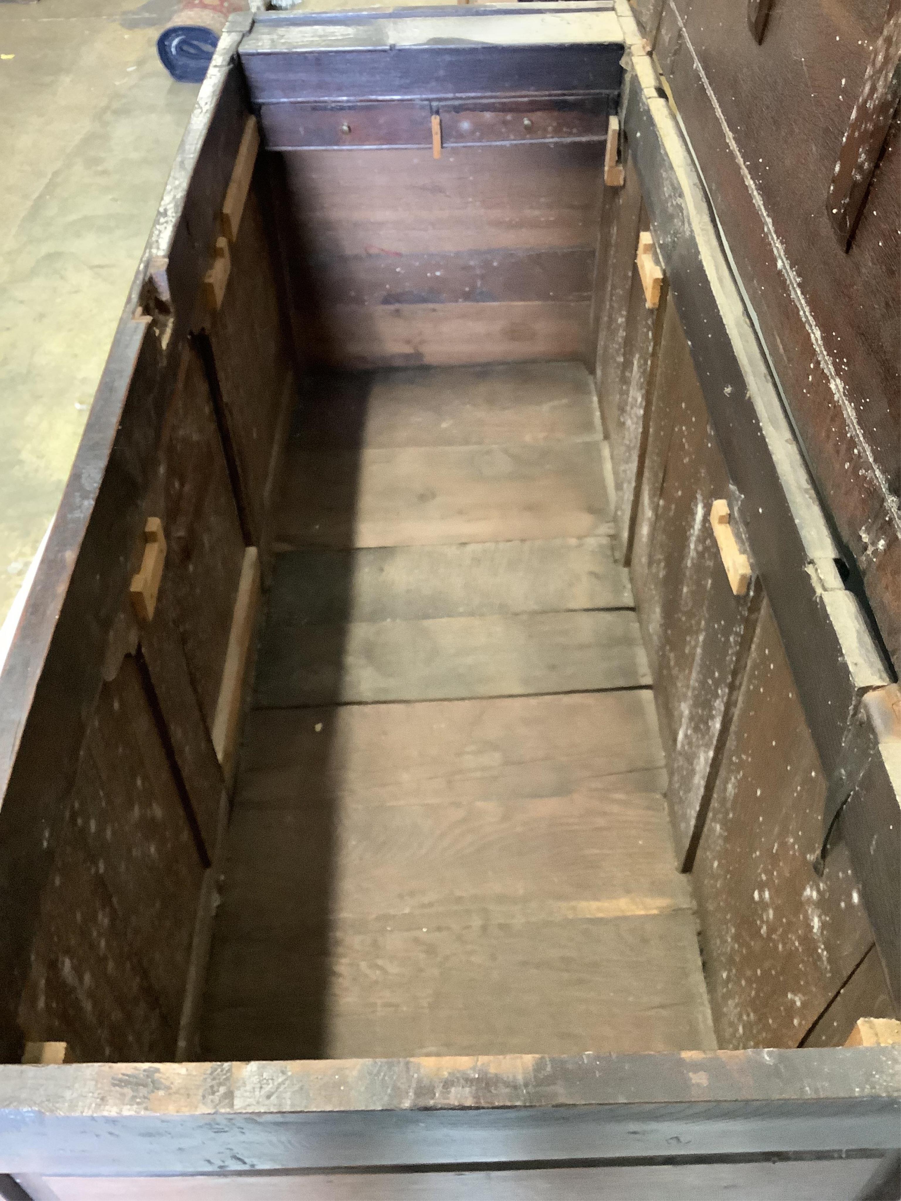 An 18th century panelled oak mule chest, adapted, width 152cm, depth 54cm, height 92cm. Condition - fair